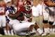 NORMAN, OK - SEPTEMBER 27: Running back DeMarco Murray #7 of the Oklahoma Sooners is tackled by Jerry Hughes #98 of the TCU Horned Frogs at Memorial Stadium on September 27, 2008 in Norman, Oklahoma. (Photo by Ronald Martinez/Getty Images)