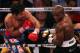 LAS VEGAS, NV - JUNE 09: (L-R) Manny Pacquiao lands a left to the head of Timothy Bradley during their WBO welterweight title fight at MGM Grand Garden Arena on June 9, 2012 in Las Vegas, Nevada. (Photo by Jeff Bottari/Getty Images)