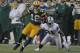 GREEN BAY, WI - DECEMBER 11: Randall Cobb #18 of the Green Bay Packers moves past Lito Sheppard #21 of the Oakland Raiders at Lambeau Field on December 11, 2011 in Green Bay, Wisconsin. The Packers defeated the Raiders 46-16. (Photo by Jonathan Daniel/Getty Images)