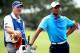 KIAWAH ISLAND, SC - AUGUST 10: Tiger Woods of the United States (R) and his caddie Joe LaCava look on from the second hole during Round Two of the 94th PGA Championship at the Ocean Course on August 10, 2012 in Kiawah Island, South Carolina. (Photo by Andrew Redington/Getty Images)