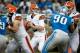 Aug 10, 2012; Detroit, MI, USA; Cleveland Browns quarterback Brandon Weeden (3) drops back to pass while being pressured by Detroit Lions defensive tackle Ndamukong Suh (90) during the first quarter of a preseason game at Ford Field. Mandatory Credit: Tim Fuller-US PRESSWIRE