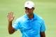Tiger Woods survived the high winds on Friday and is tied for the lead at the PGA Championship