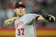 PHOENIX, AZ - AUGUST 10: Stephen Strasburg #37 of the Washington Nationals delivers a pitch against the Arizona Diamondbacks at Chase Field on August 10, 2012 in Phoenix, Arizona. (Photo by Norm Hall/Getty Images)