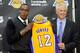 EL SEGUNDO, CA - AUGUST 10: Dwight Howard (L) is introduced to the media as the newest member of the Los Angeles Lakers by General Manager Mitch Kupchak during a news conference at the Toyota Sports Center on August 10, 2012 in El Segundo, California. The Lakers aquired Howard from Orlando Magic in a four-team trade. In addition, Lakers wil receive Chris Duhon and Earl Clark from the Magic. (Photo by Kevork Djansezian/Getty Images)