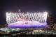 LONDON, ENGLAND - JULY 28: The Olympic Stadium is illuminated during the Opening Ceremony of the Olympic Games on July 28, 2012 in London, England. Athletes, heads of state and dignitaries from around the world have gathered in the Olympic Stadium for the opening ceremony of the 30th Olympiad. London plays host to the 2012 Olympic Games which will see 26 sports contested by 10,500 athletes over 17 days of competition. (Photo by Oli Scarff/Getty Images)