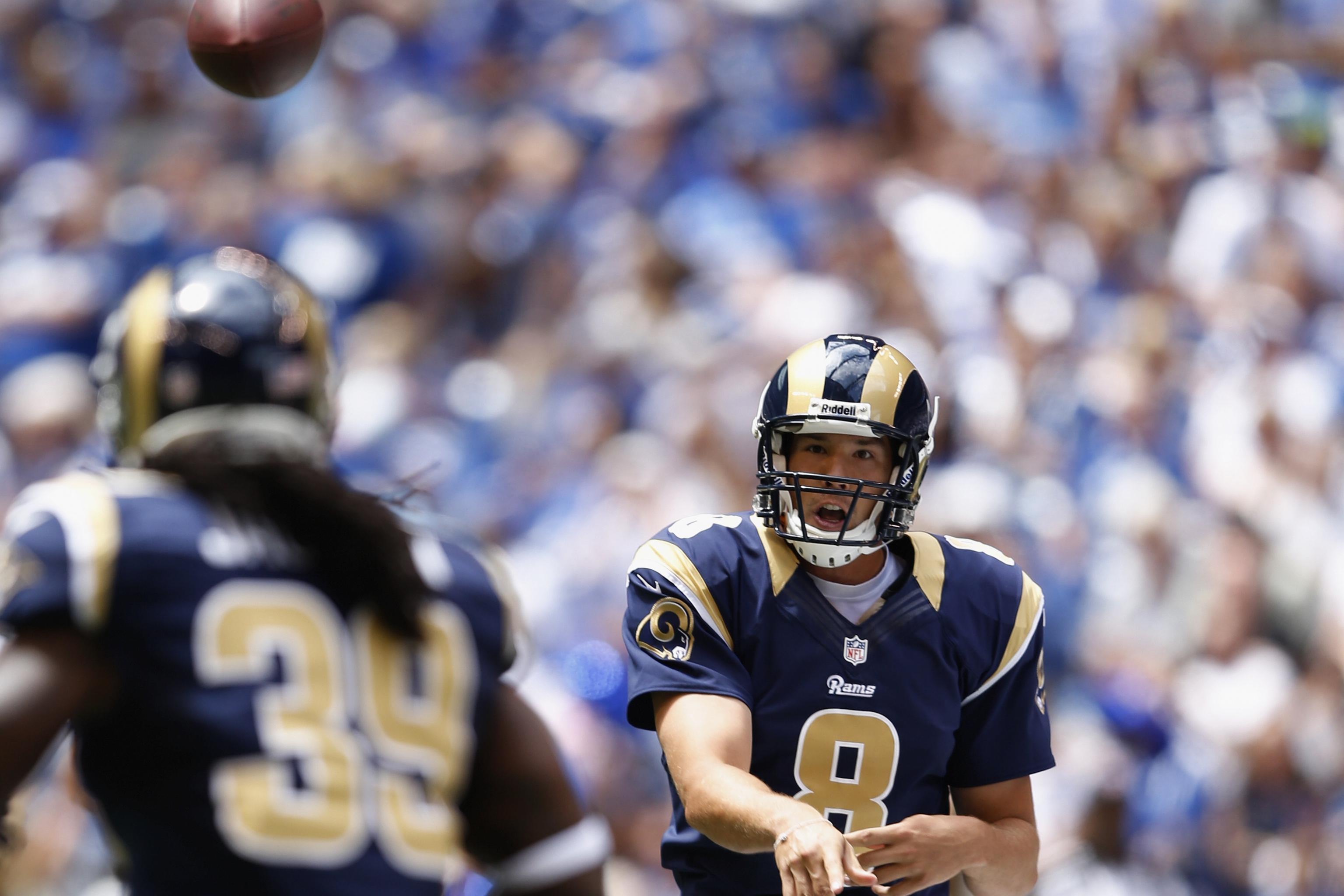 St. Louis Rams rookie Jason Smith (L) looks on as former St. Louis