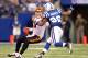 INDIANAPOLIS - NOVEMBER 14: Carson Palmer #9 of the Cincinnati Bengals tries to avoid Jerry Hughes #92 of the Indianapolis Colts during the NFL game at Lucas Oil Stadium on November 14, 2010 in Indianapolis, Indiana. The Colts won 23-17. (Photo by Andy Lyons/Getty Images)
