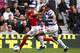 LONDON, ENGLAND - MARCH 31: Robin van Persie of Arsenal and Anton Ferdinand of Queens Park Rangers battle for the ball during the Barclays Premier League match between Queens Park Rangers and Arsenal at Loftus Road on March 31, 2012 in London, England. (Photo by Ian Walton/Getty Images)