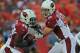 KANSAS CITY, MO - AUGUST 10: Quarterback John Skelton #19 of the Arizona Cardinals hands off the ball to running back Alfonso Smith #46 of the Kansas City Chiefs during the first half on August 10, 2012 at Arrowhead Stadium in Kansas City, Missouri. (Photo by Peter Aiken/Getty Images)