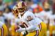 ORCHARD PARK, NY - AUGUST 09: Robert Griffin III #10 of the Washington Redskins takes a snap against the Buffalo Bills at Ralph Wilson Stadium on August 9, 2012 in Orchard Park, New York. (Photo by Rick Stewart/Getty Images)