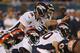 CHICAGO, IL - AUGUST 09: Peyton Manning #18 of the Denver Broncos calls out the defense against the Chicago Bears during a preseason game at Soldier Field on August 9, 2012 in Chicago, Illinois. The Broncos defeated the Bears 31-3. (Photo by Jonathan Daniel/Getty Images)