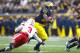 November 19, 2011; Ann Arbor, MI, USA; Michigan Wolverines running back Fitzgerald Toussaint (28) breaks a tackle by Nebraska Cornhuskers safety Daimion Stafford (3) at Michigan Stadium. Mandatory Credit: Rick Osentoski-US PRESSWIRE