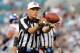 JACKSONVILLE, FL - AUGUST 10: Replacement referee Jerry Hughes catches a football as the New York Giants play against the Jacksonville Jaguars in a pre-season football game August 10, 2011 at EverBank Field in Jacksonville, Florida. (Photo by Al Messerschmidt/Getty Images)