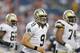 FOXBORO, MA - AUGUST 9: Drew Brees #9, Ben Grubbs #66, and Jermon Bushrod #74 of the New Orleans Saints head to the sideline against the New England Patriots in the first half at Gillette Stadium on August 9, 2012 in Foxboro, Massachusetts. (Photo by Jim Rogash/Getty Images)