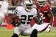 GLENDALE, AZ - AUGUST 17: Running back Mike Goodson #25 of the Oakland Raiders rushes the football past linebacker Quan Sturdivant #52 of the Arizona Cardinals during the first half of the NFL preseason game at the University of Phoenix Stadium on August 17, 2012 in Glendale, Arizona. (Photo by Christian Petersen/Getty Images)