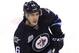 WINNIPEG, CANADA - MARCH 26: Spencer Machacek #46 of the Winnipeg Jets skates down the ice during a game against the Ottawa Senators in NHL action at the MTS Centre on March 26, 2012 in Winnipeg, Manitoba, Canada. (Photo by Marianne Helm/Getty Images)