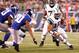 Aug. 18, 2011; East Rutherford, NJ, USA;New York Jets quarterback Tim Tebow (15) runs with the ball as New York Giants defensive back Justin Tryon (30) gives chase during the second half at MetLife Stadium. Giants won 26-3. Mandatory Credit: Debby Wong-US PRESSWIRE