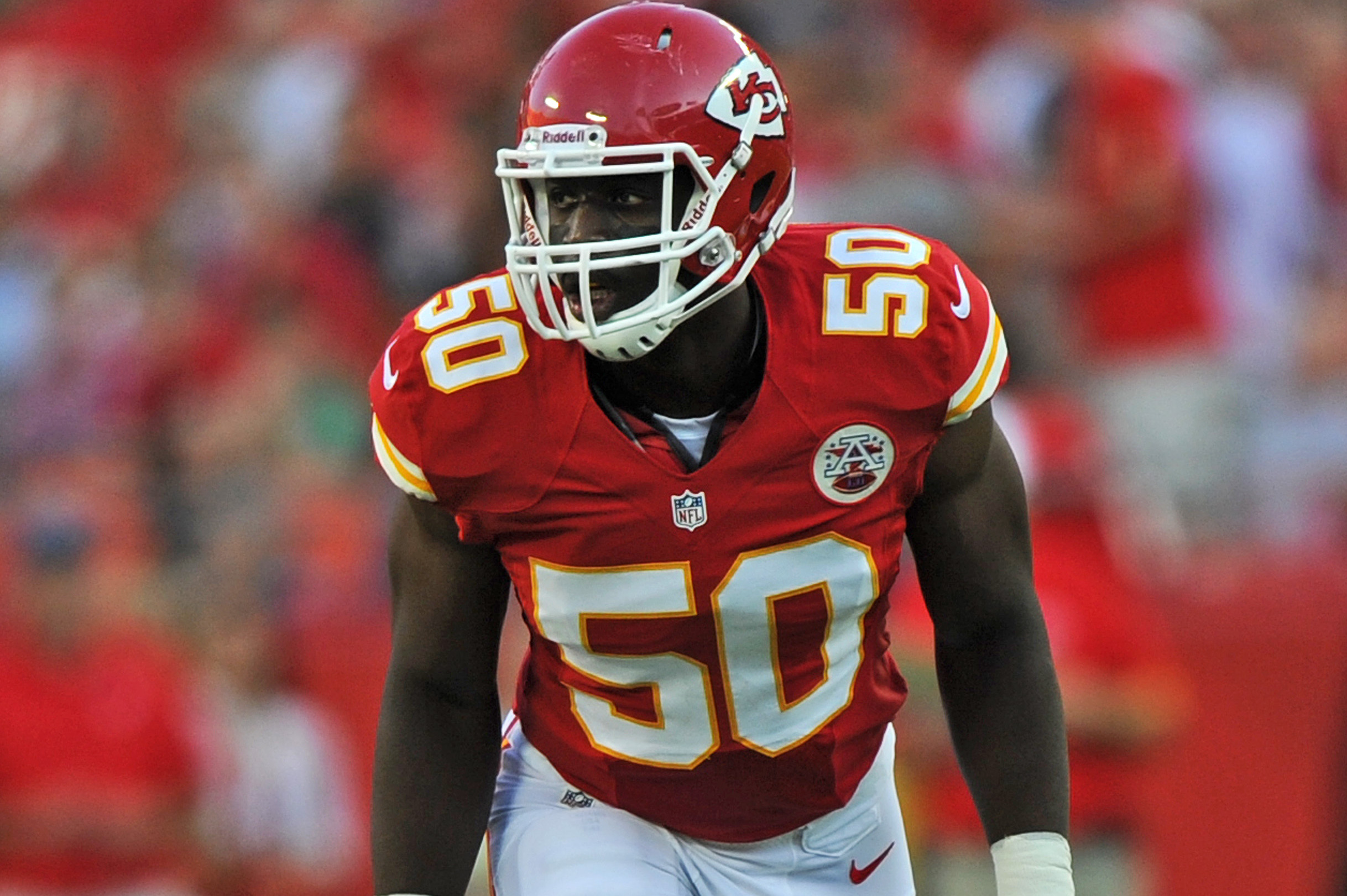 Kansas City Chiefs linebackers Justin Houston (50) and Tamba Hali (91) walk  between drills at NFL football t…