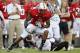 RALEIGH, NC - SEPTEMBER 3: Wide receiver Jarvis Williams #5 of the North Carolina State Wolfpack breaks a tackle against Akeem Auguste #3 of the South Carolina Gamecocks during the game at Carter-Finley Stadium on September 3, 2009 in Raleigh, North Carolina. (Photo by Streeter Lecka/Getty Images)