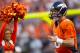 DENVER, CO - AUGUST 18: Quarterback Peyton Manning #18 of the Denver Broncos runs onto the field before taking on the Seattle Seahawks at Sports Authority Field Field at Mile High on August 18, 2012 in Denver, Colorado. (Photo by Justin Edmonds/Getty Images)