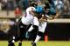 JACKSONVILLE, FL - OCTOBER 24: Pernell McPhee #90 of the Baltimore Ravens tackles Blaine Gabbert #11 of the Jacksonville Jaguars during the game at EverBank Field on October 24, 2011 in Jacksonville, Florida. (Photo by Sam Greenwood/Getty Images)