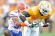 KNOXVILLE, TN - SEPTEMBER 18: Brian Biada #31 of the Florida Gators tackles Da'Rick Rogers #21 of the Tennessee Volunteers at Neyland Stadium on September 18, 2010 in Knoxville, Tennessee. Florida won 31-17. (Photo by Grant Halverson/Getty Images)