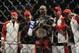 Apr 21, 2012; Atlanta, GA, USA; Jon Jones poses with his crew after beating Rashad Evans in the main event and light heavyweight title bout during UFC 145 at Philips Arena. Jon Jones won the bout by unanimous decision. Mandatory Credit: Paul Abell-US PRESSWIRE