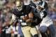 SOUTH BEND, IN - SEPTEMBER 17: Keith Mumphery #25 of the Michigan State Spartans tackles John Goodman #81 of the Notre Dame Fighting Irish during the second half September 17, 2011 at Notre Dame Stadium in South Bend, Indiana. (Photo by John Gress/Getty Images)