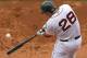 BOSTON, MA - AUGUST 5: Adrian Gonzalez #28 of the Boston Red Sox connects for a two-run home run i n the fifth inning against the Minnesota Twins at Fenway Park August 5, 2012 in Boston, Massachusetts. (Photo by Jim Rogash/Getty Images)