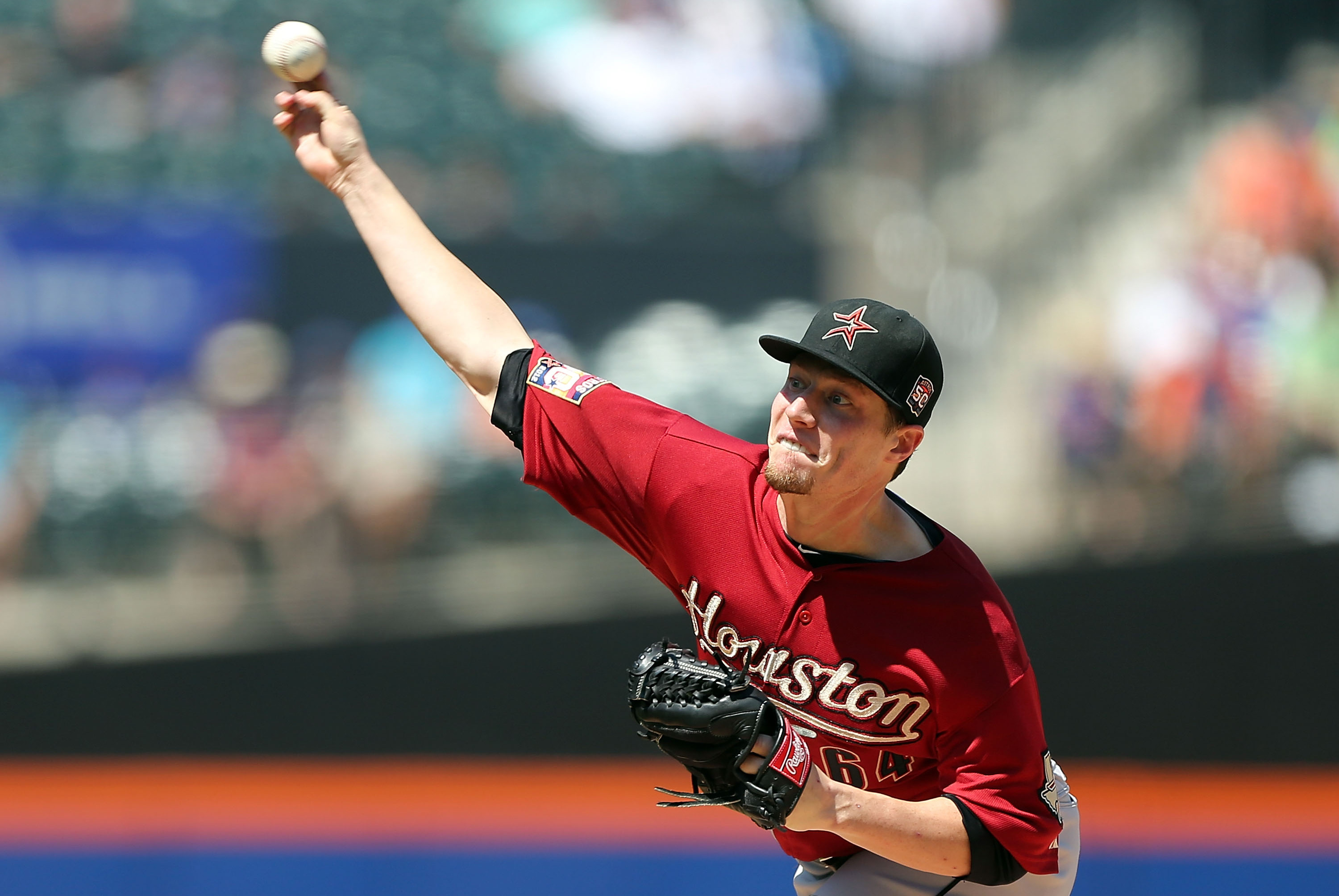 Houston Astros starting pitcher Lucas Harrell receives a new ball