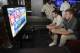 CHICAGO, IL - JUNE 21: L-R Nick Jonas plays Madden NFL 13 with Kyle Johnson at the EA SPORTS Pigskin Pro-Am Eve on June 21 2012 in Chicago, Illinois. (Photo by David Banks/Getty Images for EA Sports)