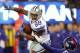 EAST RUTHERFORD, NJ - JANUARY 1: Dez Bryant #88 of the Dallas Cowboys attempts to get by Jacquian Williams #57 of the New York Giants during a game at MetLife Stadium on January 1, 2012 in East Rutherford, New Jersey. (Photo by Rich Schultz /Getty Images)
