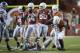 Nov 19 2011; Austin, TX, USA; Texas Longhorns linebacker Emmanuel Acho (18), safety Kenny Vaccaro (4), Blake Gideon (21), defensive end Jackson Jeffcoat (44) and defensive tackle Calvin Howell (90) react after tackling Kansas State Wildcats quarterback Collin Klein (center) during the fourth quarter at Royal-Texas Memorial Stadium. Kansas State beat Texas 17-13. Mandatory Credit: Brendan Maloney-US PRESSWIRE