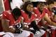 GLENDALE, AZ - AUGUST 17: linebacker Reggie Walker #56 of the Arizona Cardinals sits on the sidelines during the NFL preseason game against the Oakland Raiders at the University of Phoenix Stadium on August 17, 2012 in Glendale, Arizona. (Photo by Christian Petersen/Getty Images)