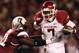 COLUMBIA, SC - NOVEMBER 06: Knile Davis #7 of the Arkansas Razorbacks pushes away from Josh Dickerson #41 of the South Carolina Gamecocks during their game at Williams-Brice Stadium on November 6, 2010 in Columbia, South Carolina. (Photo by Streeter Lecka/Getty Images)