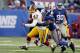 EAST RUTHERFORD, NJ - DECEMBER 05: Deon Grant #34 of the New York Giants forces a fourth quarter fumble against Chris Cooley #47 of the Washington Redskins on December 5, 2010 at the New Meadowlands Stadium in East Rutherford, New Jersey. The Giants defeated the Redskins 31-7. (Photo by Jim McIsaac/Getty Images)