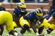 April 14, 2012; Ann Arbor, MI, USA; Michigan Wolverines quarterback Denard Robinson (16) gets ready to take the snap from offensive linesman Ricky Barnum (52) during the Michigan spring game at Michigan Stadium. Mandatory Credit: Rick Osentoski-US PRESSWIRE