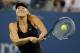 NEW YORK, NY - SEPTEMBER 02: Maria Sharapova of Russia returns a shot to Nadia Petrova of Russia on Day Seven of the 2012 U.S. Open at the USTA Billie Jean King National Tennis Center on September 2, 2012 in the Flushing neighborhood, of the Queens borough of New York City. (Photo by Mike Stobe/Getty Images for USTA)