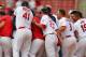 ST. LOUIS, MO - JULY 8: Members of the St. Louis Cardinals mob Rafael Furcal #15 also of the St. Louis Cardinals after Furcal hit a walk-off single against the Miami Marlins at Busch Stadium on July 8, 2012 in St. Louis, Missouri. (Photo by Dilip Vishwanat/Getty Images)