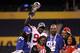 Feb 5, 2012; Indianapolis, IN, USA; New York Giants defensive end Jason Pierre-Paul (90) poses with his family including his father Jean Pierre-Paul (center) as he holds the Lombardi Trophy after Super Bowl XLVI at Lucas Oil Stadium. Mandatory Credit: Matthew Emmons-US PRESSWIRE