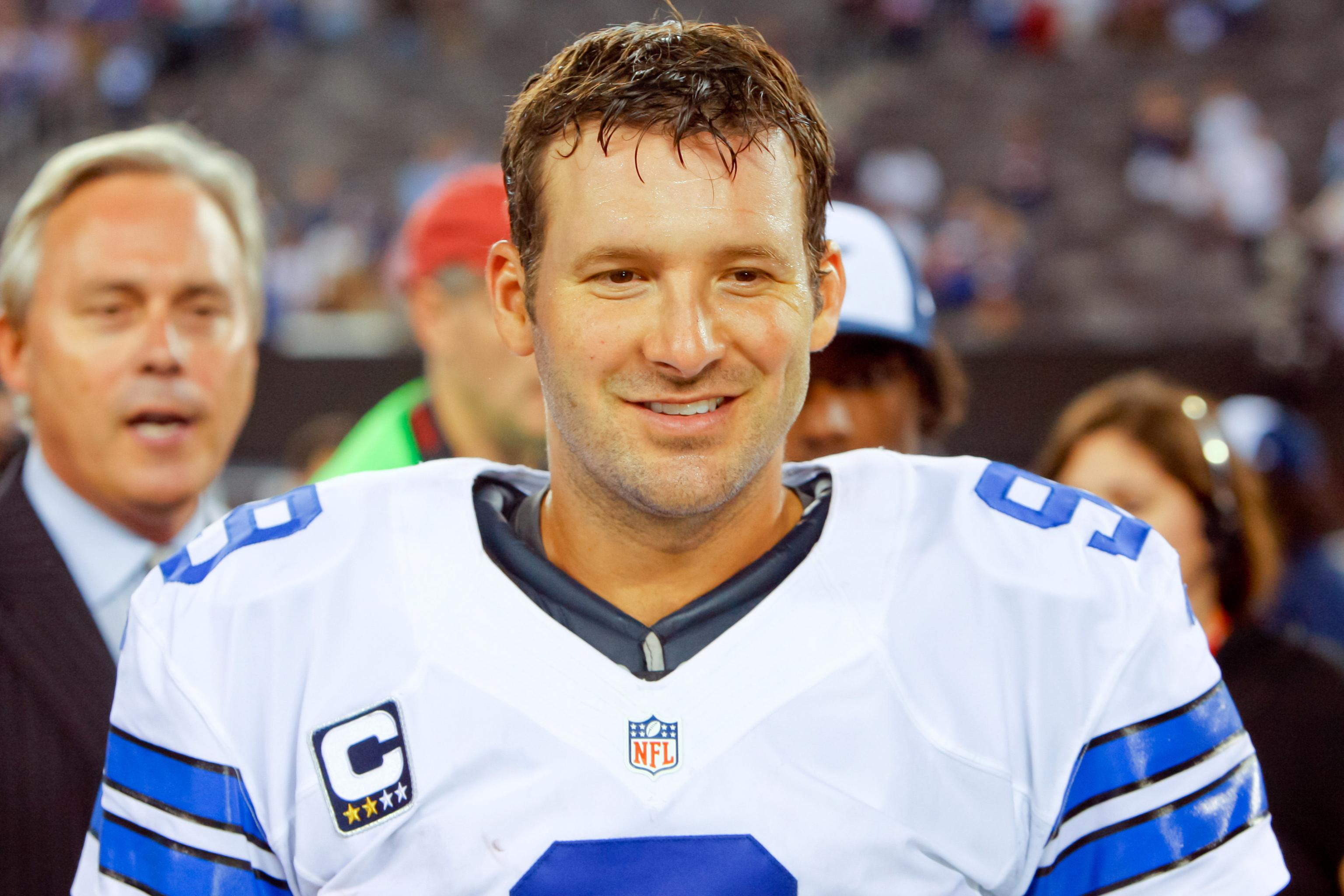 Dallas Cowboys quarterback Tony Romo (9) runs out of the pocket looking to  pass against the New York Giants in the fourth quarter in week 1 of the NFL  season at MetLife Stadium in East Rutherford, New Jersey on September 5,  2012. UPI/Rich Kane Stock