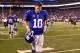 EAST RUTHERFORD, NJ - SEPTEMBER 05: Quarterback Eli Manning #10 of the New York Giants runs off of the field after losing to the Dallas Cowboys by the score of 24-17 during the 2012 NFL season opener at MetLife Stadium on September 5, 2012 in East Rutherford, New Jersey. (Photo by Al Bello/Getty Images)