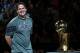 DALLAS, TX - DECEMBER 25: Owner Mark Cuban of the Dallas Mavericks stands with the NBA trophy before a game against the Miami Heat on opening day of the NBA season at American Airlines Center on December 25, 2011 in Dallas, Texas. NOTE TO USER: User expressly acknowledges and agrees that, by downloading and/or using this Photograph, user is consenting to the terms and conditions of the Getty Images License Agreement. (Photo by Ronald Martinez/Getty Images)