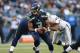 SEATTLE, WA - AUGUST 30: Quarterback Russell Wilson #3 of the Seattle Seahawks drops back against the Oakland Raiders at CenturyLink Field on August 30, 2012 in Seattle, Washington. (Photo by Otto Greule Jr/Getty Images)