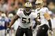 NEW ORLEANS, LA - OCTOBER 23: Jonathan Vilma #51 of the New Orleans Saints calls a defensive play during a game against the Indianapolis Colts being held at Mercedes-Benz Superdome on October 23, 2011 in New Orleans, Louisiana. The Saints defeated the Colts 62-7. (Photo by Stacy Revere/Getty Images)