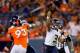 DENVER, CO - AUGUST 18: Quarterback Russell Wilson #3 of the Seattle Seahawks throws a pass for a completion as defensive end Jeremy Beal #93 of the Denver Broncos applies pressure during the fourth quarter at Sports Authority Field Field at Mile High on August 18, 2012 in Denver, Colorado. The Seahawks defeated the Broncos 30-10. (Photo by Justin Edmonds/Getty Images)