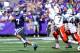Sep 8, 2012; Manhattan, KS, USA; Kansas State Wildcats quarterback Collin Klein (7) runs away from Miami Hurricanes defensive back Vaughn Telemaque (7) and linebacker Eddie Johnson (44) during the Wildcats' 52-13 win at Bill Snyder Family Stadium. Mandatory Credit: Scott Sewell-US PRESSWIRE