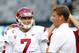 EAST RUTHERFORD, NJ - SEPTEMBER 8: Matt Barkley #7 of the USC Trojans talks with head coach Lane Kiffin before the start of their game against the Syracuse Orange at MetLife Stadium on September 8, 2012 in East Rutherford, New Jersey. (Photo by Rich Schultz /Getty Images)