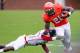 CHARLOTTESVILLE, VA - SEPTEMBER 01: Wide receiver Tim Smith (20) of the Virginia Cavaliers runs with the ball past defensive back Wayne Pettus (2) of the Richmond Spiders at Scott Stadium on September 1, 2012 in Charlottesville, Virginia. (Photo by Geoff Burke/Getty Images)