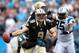 CHARLOTTE, NC - SEPTEMBER 16: Drew Brees #9 of the New Orleans Saints is sacked by Greg Hardy #76 of the Carolina Panthers during their game at Bank of America Stadium on September 16, 2012 in Charlotte, North Carolina. (Photo by Streeter Lecka/Getty Images)